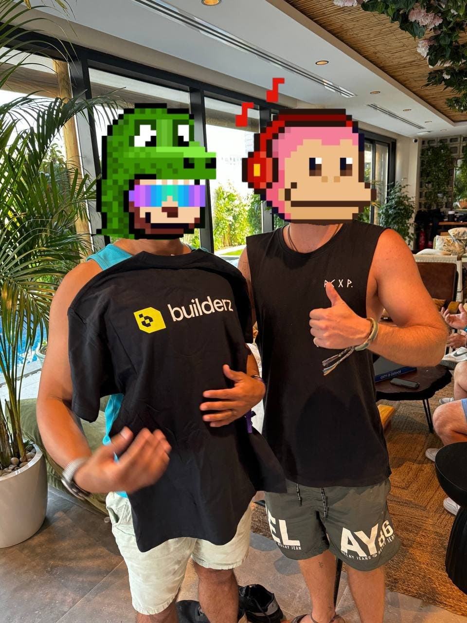 Historical photo of a Builderz t-shirt being shown at a Dubai meetup during Token2049 week.